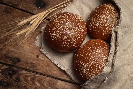 Homemade sourdough bread. Round buns isolated on wooden  background