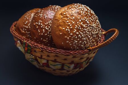 Homemade sourdough bread. Burger bun isolated on black background.の写真素材