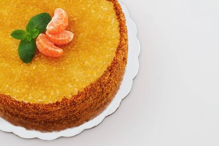 Honey cake with golden pearls and mint leaf and fruits isolated on white background