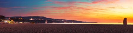 Sunrise on the beach, Varna cityscape by autumn, Bulgaria.の写真素材