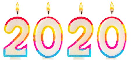 2020 Happy new year burning party candles isolated on white.の写真素材