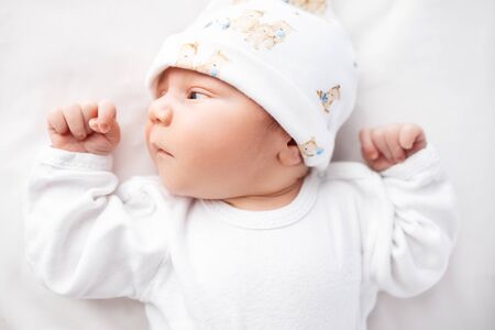 Newborn adorable one week baby boy sleeping.