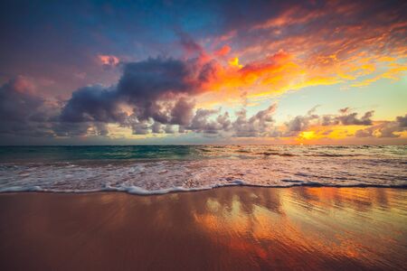 Beach sunrise over the tropical seaの写真素材