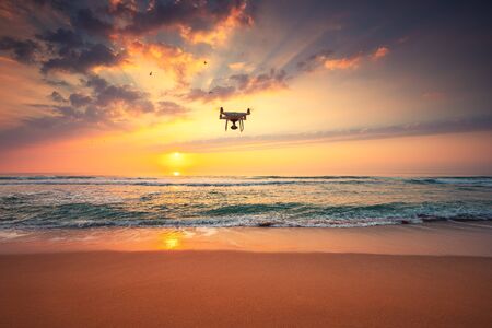 Beautiful morning over the sea and flying drone.の写真素材