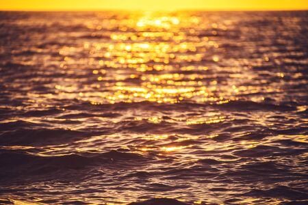 Sea sunset.  Ocean Ripples waves as water texture background.
の写真素材