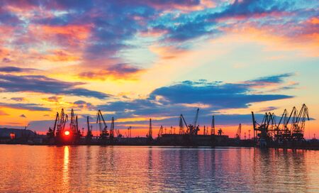 Sea port and industrial cranes, Varna, Bulgaria.Sunset over the Varna lakeの写真素材