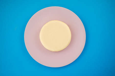 Homemade tasty cheesecake with chocolate in a plate isolated