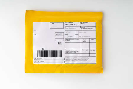 Small paper post packet isolated on the white background.の写真素材