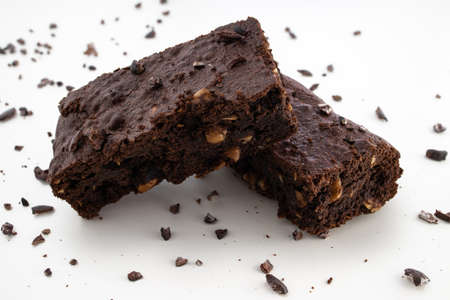 Brownie pieces on white background. Delicious chocolate pie.の写真素材