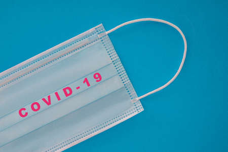 Doctor, medical mask isolated on blue background, Corona protection, covid-19の写真素材