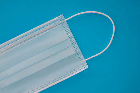 Doctor, medical mask isolated on blue background, Corona protection, covid-19の写真素材