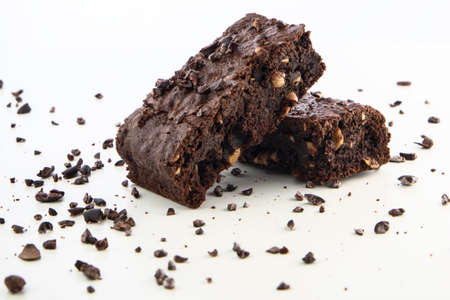 Brownie pieces on white background. Delicious chocolate pie.の写真素材