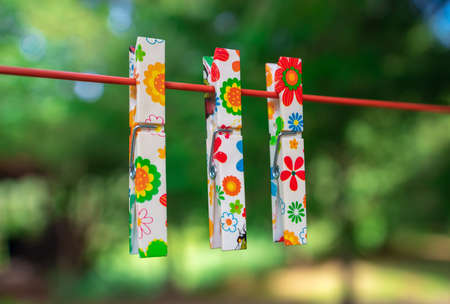 Colorful clothespins on clotheslineの写真素材