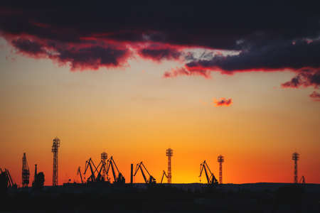 Sea port and industrial cranes, Varna, Bulgaria.Sunset over the Varna lake