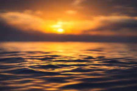 Sea wave close up, low angle view, sunrsie shot.の写真素材