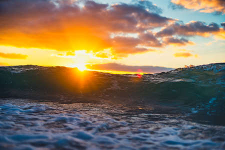 Sea wave close up, low angle view, sunrsie shot.の写真素材