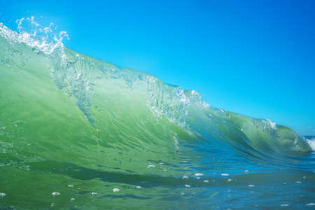 Sea wave close up, low angle view, sunrsie shot.の写真素材