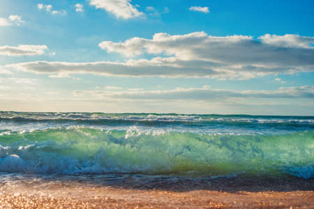 Sea wave close up, low angle view, sunrsie shot.の写真素材