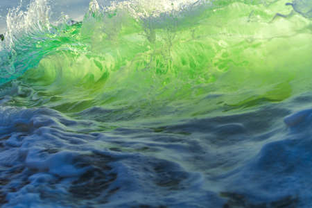Sea wave close up, low angle view, sunrsie shot.の写真素材