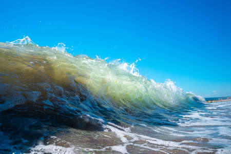 Sea wave close up, low angle view, sunrsie shot.の写真素材