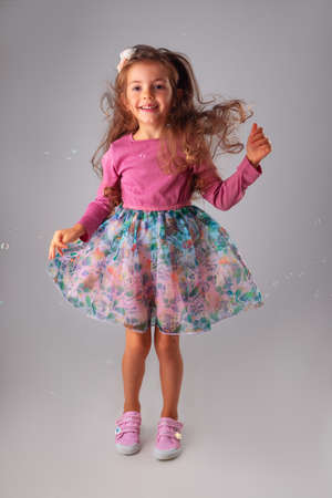 Happy birthday girl in party dress portrait with copyspace for text.の写真素材