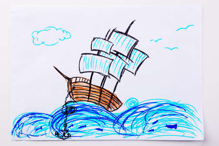 Children's paint ship in sea. Kid drawing a pirate ship and ocean waves.の写真素材