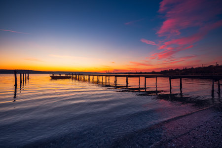 Small Dock and Boat at the lake, sunset shotの写真素材
