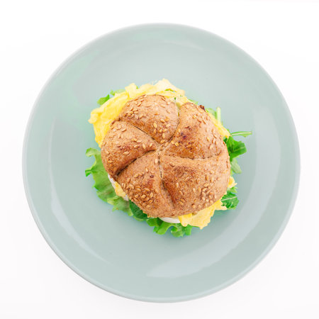 Burger on plate isolated on whiteの写真素材