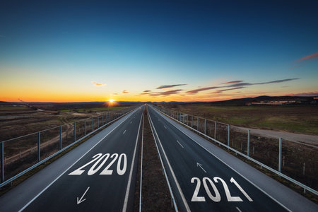 Driving on open road at beautiful sunny day to new year 2021. Aerial viewの写真素材