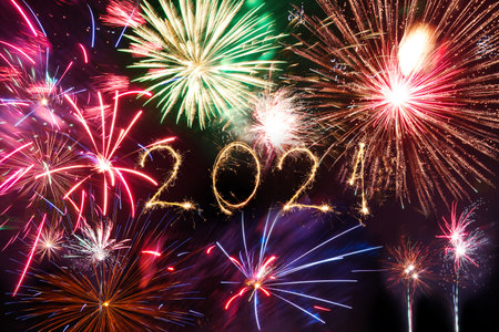 2021 Happy New Year written with Sparkle firework on black background,の写真素材