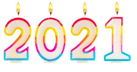 2021 Happy new year burning party candles isolated on white.の写真素材