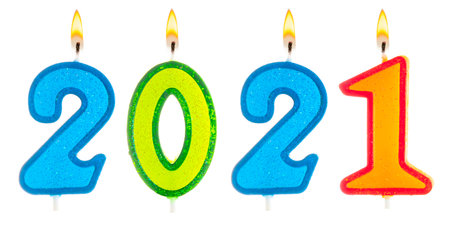 2021 Happy new year burning party candles isolated on white.の写真素材