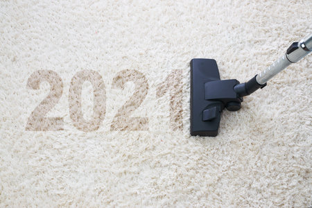 Home cleaning with vacuum cleaner and copy space for a text, new year 2021の写真素材