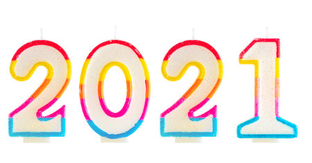 2021 Happy new year burning party candles isolated on white.の写真素材
