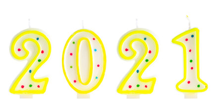 2021 Happy new year burning party candles isolated on white.の写真素材