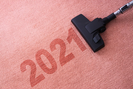 2021 New year home cleaning with vacuum cleaner and copy space for a textの写真素材