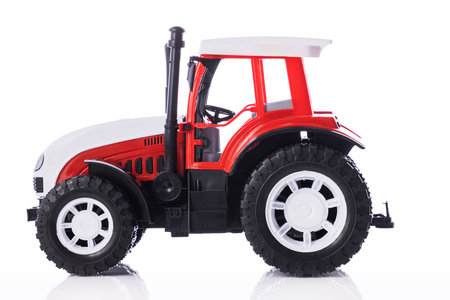 Tractor, kids toy isolated on white backgroundの写真素材