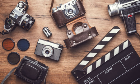 Vintage retro camera with clapboard on wooden backgroundの写真素材