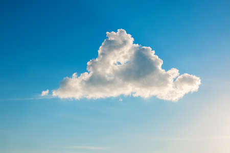 Blue sunset sky and white fluffy cloud as nature backgroundの写真素材