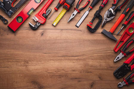 Assorted work tools on wood backgroundの写真素材