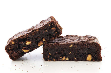 Brownie pieces on white background. Delicious chocolate pie.の写真素材
