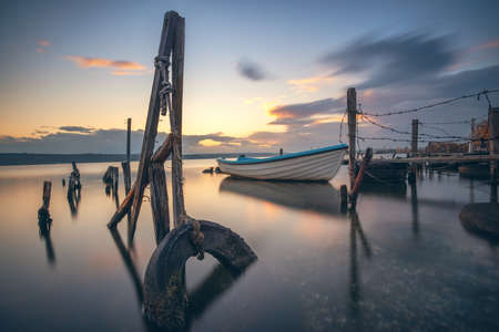 Small dock and fishing boat at fishing village, long exposureの写真素材