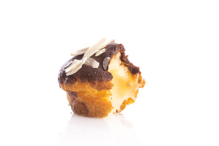 French eclairs or sweet Italian profiteroles isolated on white backgroundの写真素材