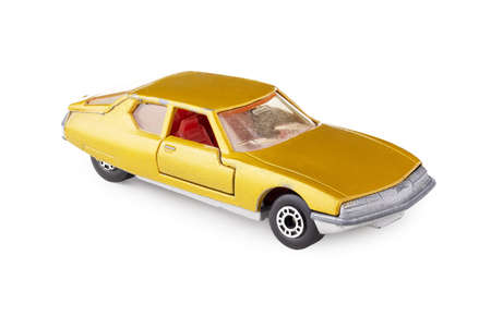 Retro car, miniature collectible vintage toy, isolated on white background with clipping pathの写真素材