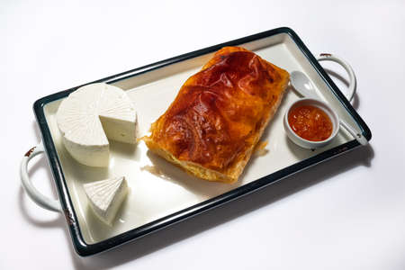 Baked cheese pie with milk. Bulgarian butter banitsa for breakfastの写真素材