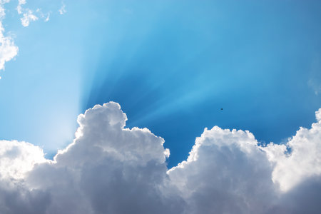 Sun, sunbeam and clouds in blue skyの写真素材