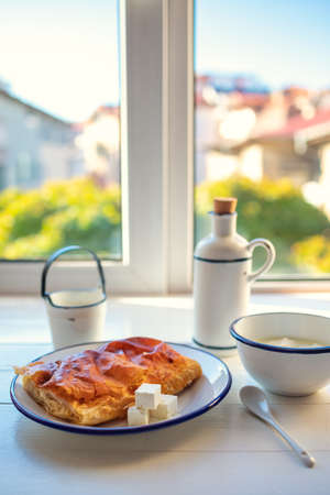 Baked cheese pie with milk. Bulgarian butter banitsa for breakfastの写真素材