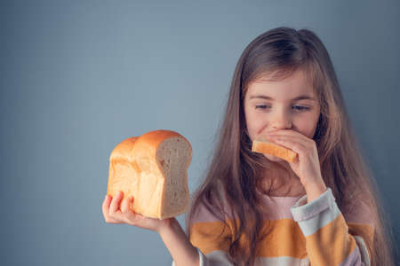 Little girl hold slice of homemade healthy bread
