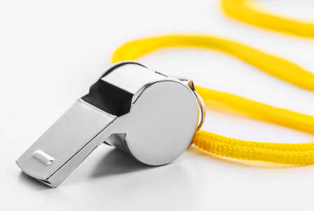 Metal sport whistle isolated on white backgroundの写真素材