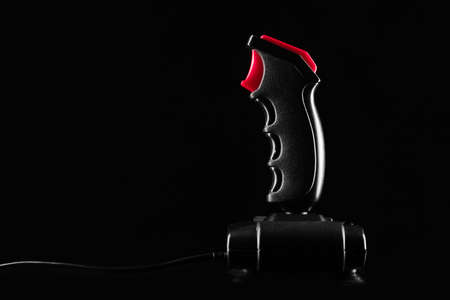 Gamepad Retro joystick from 8-bit consoles. Game controller isolated on black backgroundの写真素材